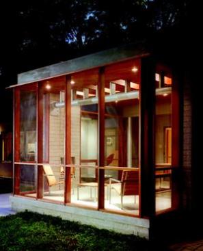 Porch rafters are supported on small steel posts carried by a steel pipe beam bolted to the masonry walls. A companion beam supports the roof on the north edge of the porch.