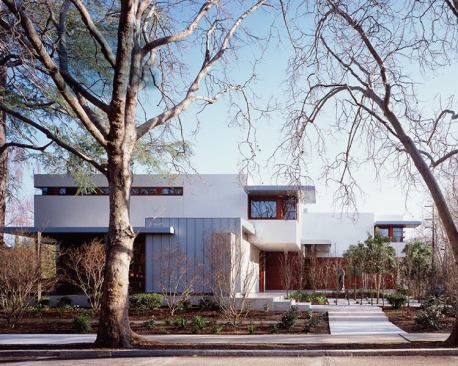 Integrally colored stucco, mahogany, and titanium zinc lend the home's exterior a sense of quiet elegance.