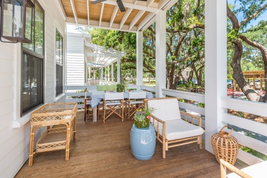 Generous first-level and second-level porches—with optional hanging day beds—allow owners to relax in a shaded outdoor setting.