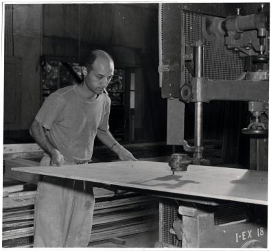Isamu Noguchi working at a band saw in his MacDougal Alley Studio, c.1940s