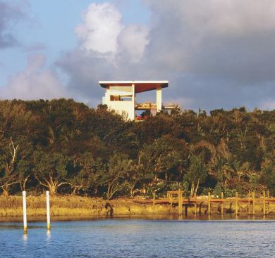 A large inverted roof is angled to provide shade for the 2002 Project of the Year's many decks and porches during summer and admit sunlight in winter. For more information on this project, 
click here.