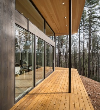 View of the exterior deck and expansive roof sheltering  scenic views of the Shawankgunk Mountains.