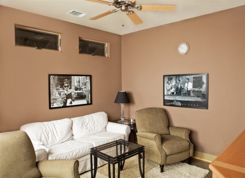 The media room features a lower ceiling for more intimate settings.