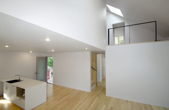 The great room of the second-floor rental unit is highlighted by a large combination living room, dining room, and kitchen.