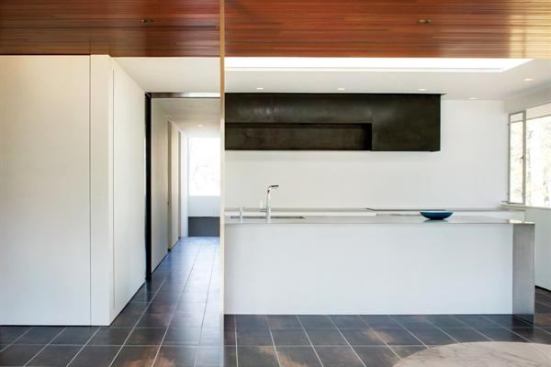 To open up a formerly closed-off kitchen, the architect employed this ultra-chic stainless steel island to connect the acid-washed steel upper cabinets with the white units below, all while maintaining the home’s airy atmosphere, earning the project a 2012 Residential Architect Design Award. Project: Neutra Glen Residence, Stamford, Conn.; Architect: Joeb Moore + Partners, Greenwich, Conn.
