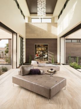The home’s two-story foyer opens completely on both sides to invite cooling breezes off the pool and basement areas below. A small library bookends the north end and heads a hallway to the master suite.