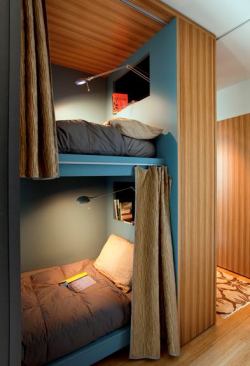 The bunk beds are styled after railroad berths.