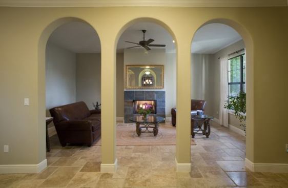 Spray-foam insulation, insulated windows, and complact flourescent light bulbs create an energy-efficient room. Travertine tile is used throughout the home.