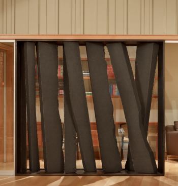 A screen of sawn basalt slabs defines a private seating area.