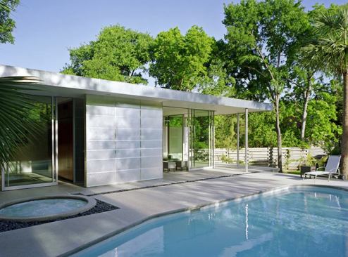 The strip of black river rock that separates the pavilion deck from the pool and encircles the spa is both functional and handsome. It collects water from the roof and prevents pool and spa water from splashing onto the pavilion deck.