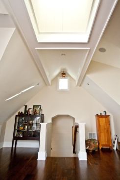 The flex room above the garage is flooded with light from the cupola windows above. The cupola offered an opportunity to design interesting architectural details for the ceiling, as well.