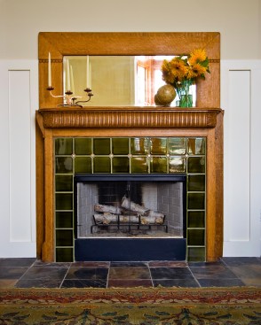 Salvage touches like a tile and tiger oak direplace surround appear throughout the house. 