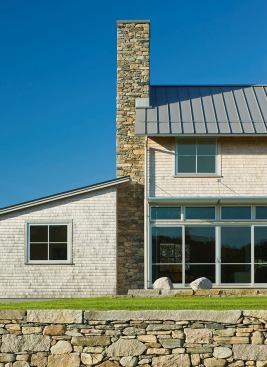 Stone walls help integrate Field House with its site, which encompasses hayfields, wetlands, and woods.