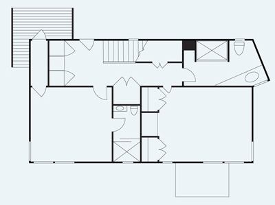 In beachfront tradition, architect James Estes located the two bedrooms on the first floor. The upstairs living areas occupy a main hall with an exposed roof structure and windows on three sides.