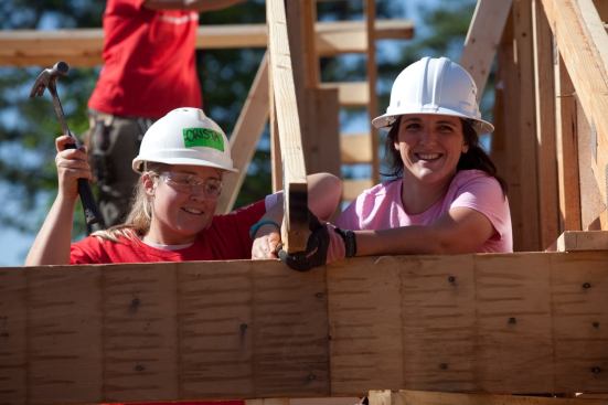 CHARLOTTE, NC -  Christa Ray with AmeriCorps and Joanna Ball with Habitat for Humanity Charlotte work on the roof structure of a home during the Habitat for Humanity Women Build in Charlotte, NC on May 5, 2011.  Celebrity on-site building is actress Emily Bergl. (Photo by Jessica McGowan)