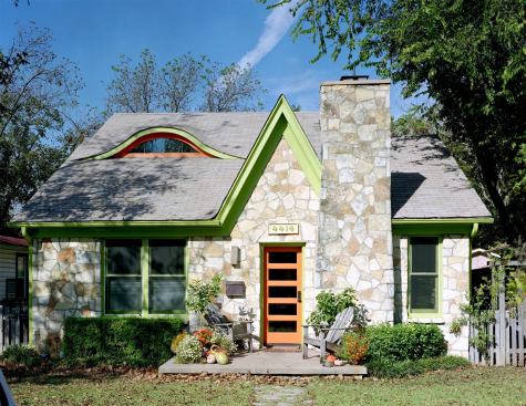 Stone cladding on this 1938 home offers a stately but visually interesting base to provide context for the front elevation’s whimsical elements. Project: Lyon Cottage; Builder/Architect: CG&S Design-Build, Austin