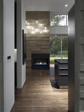 Main-level floors are dark-stained walnut.