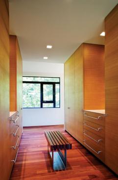 A flow-through dressing area buffers the master bedroom from the master bathroom.