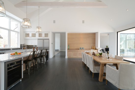 Kitchen and open dining view - not pictured is the set of 12'x9' sliders that open to the deck and cathedral ceiling.