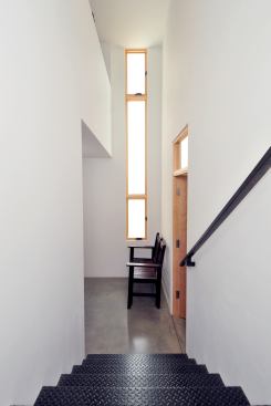 Stairway treads are made of reused diamond-plate steel.