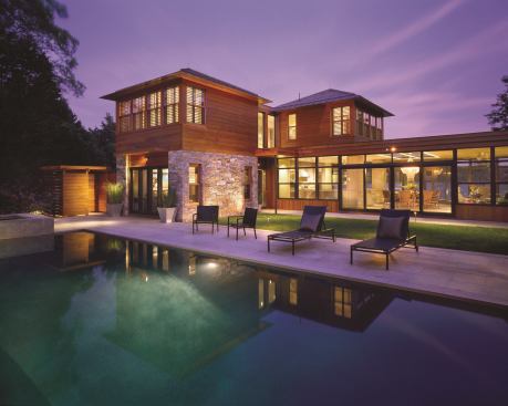 This low-slung home in Martha’s Vineyard acts as a vantage point for viewing the lagoon on one side and the property’s pool on the other. A natural palette of New England fieldstone, Western red cedar, and bronze and mahogany windows keep the focus on the natural landscape. Project: Lagoon Pond, Martha’s Vineyard, Mass.; Builder: Rosebeck Builders Corp., Edgartown, Mass.; Architect: Hutker Architects, Vineyard Haven, Mass.