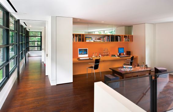 Remodeled in two phases, the house uses its back stair to tie together a three-story "vertical family room."