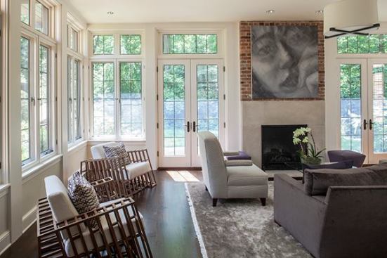 Three walls of windows line the family room, providing plenty of natural light and views into the park beyond.