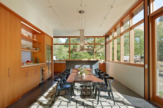 This open kitchen protects the cook’s space while still being a part of the gathering space. It strikes a deft balance: Out in the open, yet not needing cleanup when guests arrive. 
Project:
Crook | Cup | Bow | Twist, Nicasio, Calif.; 
Architect: Schwartz and Architecture, San Francisco; 
Builder: Hammond Fine Homes, Cotati, Calif.