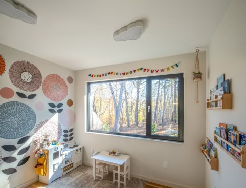 A whimsical playroom, reached solely through the two adjacent bedrooms, is a key element in the kids' portion of the "private zone."