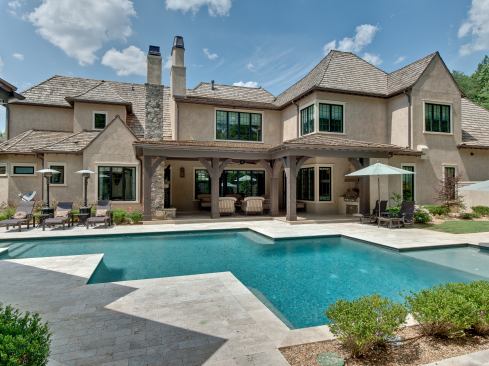 The clients really wanted a pool and a pool house, but the lot was pie-shaped. So, in a switch from the usual construction scheduling, the pool actually got built before the house, with a zig-zag quality that the owners love. Project: The Walsh Residence, Charlotte, N.C.; Builder: Kingswood Custom Homes, Pineville, N.C.