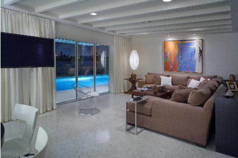 Designers removed the home's original small windows and added sliding doors to better capture the dramatic view.