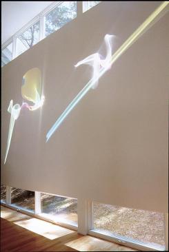  A custom light sculpture by artist Janet Saad Cook takes pride of place in the living room. 