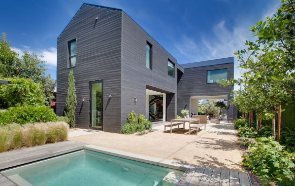 Details throughout the house, including the kitchen and bathrooms, reinforce the natural farmhouse design concept.