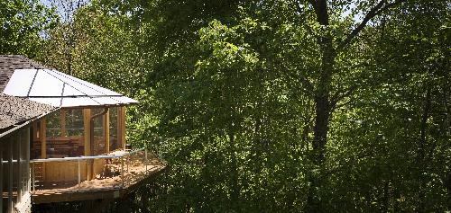 Treetop dinner: This timber-screened veranda replaced a poorly built deck and created a gathering space that is comfortable nearly year-round. Judges admired "the whimsy of it being in the trees."