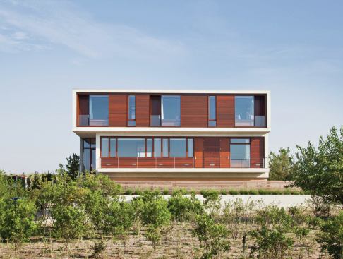 Mounted on the sides of the house, the screens add a scrim of privacy from close neighbors.