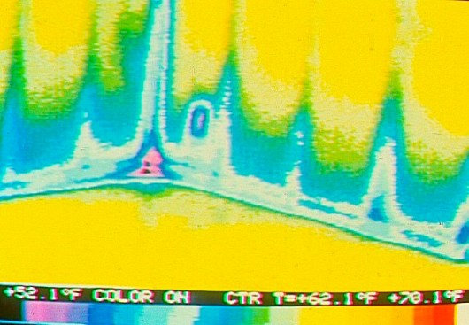 Here, wind-washing has pushed cold air several feet up the inside face of an exterior wall.