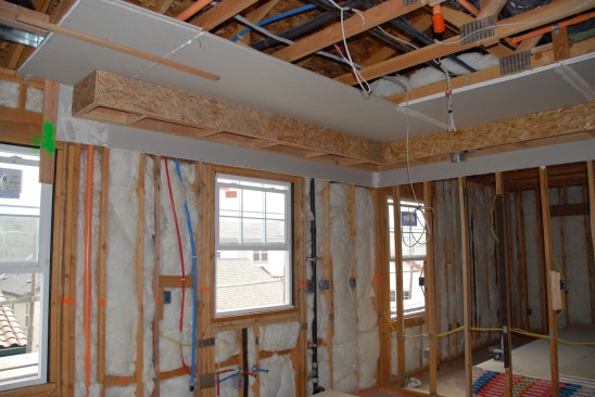 Installing drywall at the soffit location before attaching the soffit creates an effective air seal.