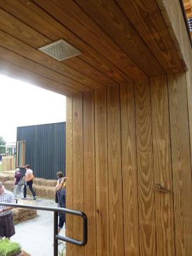 A cleverly masked exterior shower is located in a deep archway sited across from a purposeful gap between OMs to generate cross-ventilation.