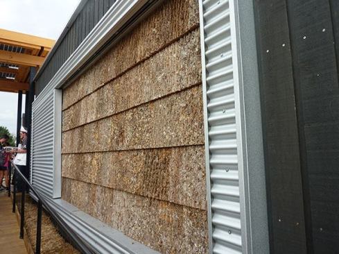 An homage to Lincoln Memorial architect Henry Bacon, who used bark siding on a group of North Carolina mountain homes in the 1890s, poplar bark shingles adorn the front façade and encase the largest outbuilding as a rustic, low-maintenance, and sustainable exterior finish.
