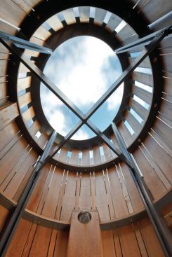 
        Once the steel frame had been lowered 
onto the porch, the team rotated it until the structural crossbars were 
in perfect alignment with the orthogonal points of a compass.