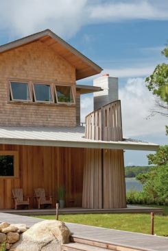 
        The narrow cedar boards are cut off in a
 pattern that mirrors the angle of the porch roof while the wider slats 
are canted in the opposite direction.
      
