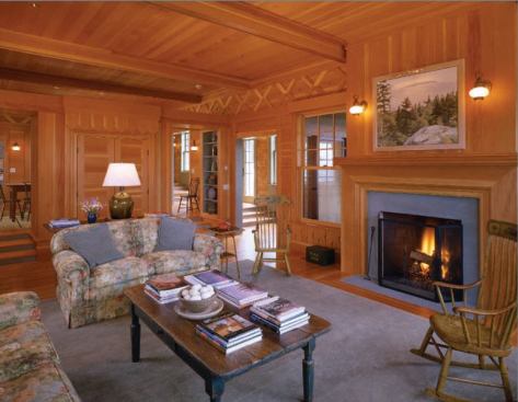 Fine woodwork on floors, walls, and ceiling create elegant cozy rooms, while the absence of doors allows spaces to feel open and airy.