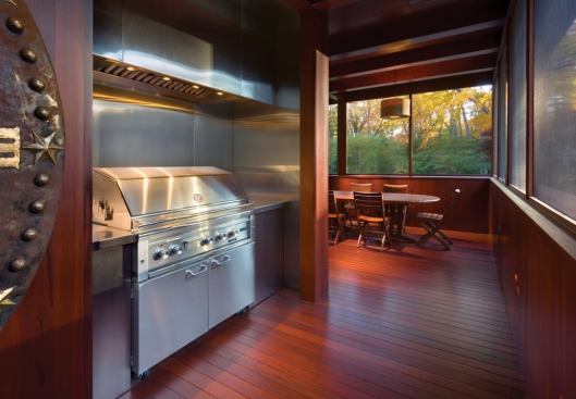 The owners enjoy meals with family and friends in their upstairs dining and barbecuing porch.