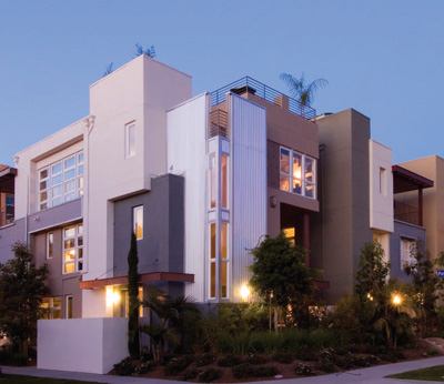 With their “contemporary brownstone” aesthetic, the four-story Park Houses use steel, glass, and colorful cement (a bold palette not often seen in production building) to create a high-end, high-density community that reduces sprawl while maintaining the feeling of single-family homes.