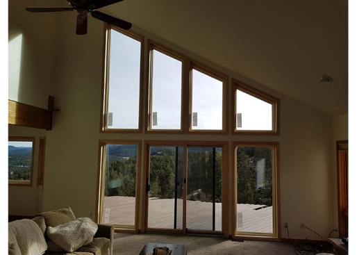 Inside view of picture windows and sliding glass door installation