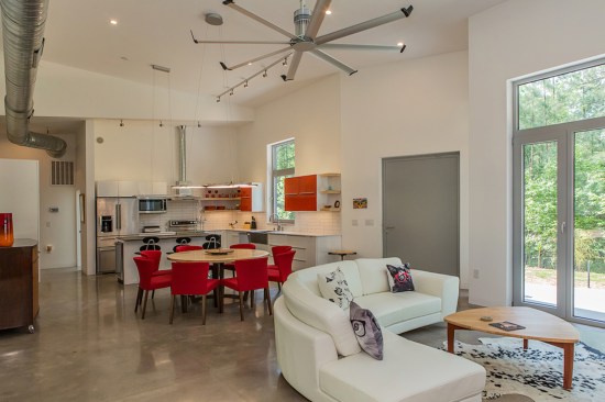 The floor is polished concrete and an element of the house's thermal mass. A factory-sized fan keeps air circulating.