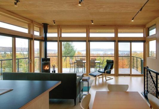 The main living floor is at the house’s top level, the better to enjoy the view over the trees to Lake Michigan.