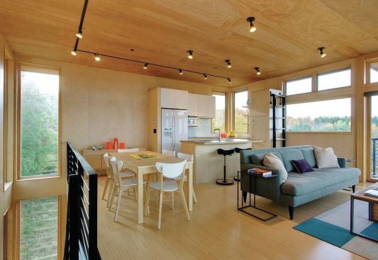 Clean detailing lends class to such economical materials as birch plywood (at the walls and ceilings) and engineered-wood flooring.