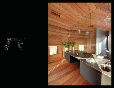 There’s a lot of geometry in the master bath, where the building turns. The vanity is made of Richlite cabinets with a volcanic stone top.