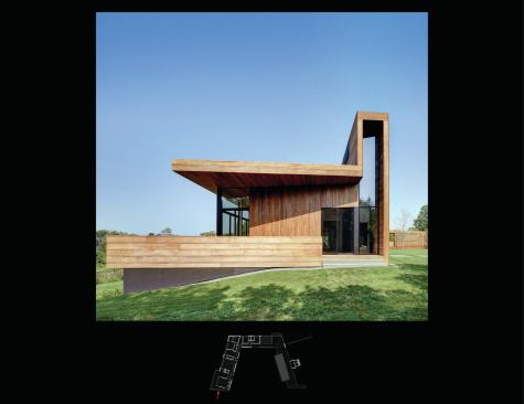 At the main house’s entrance, the decking wraps up and over a glass slot.